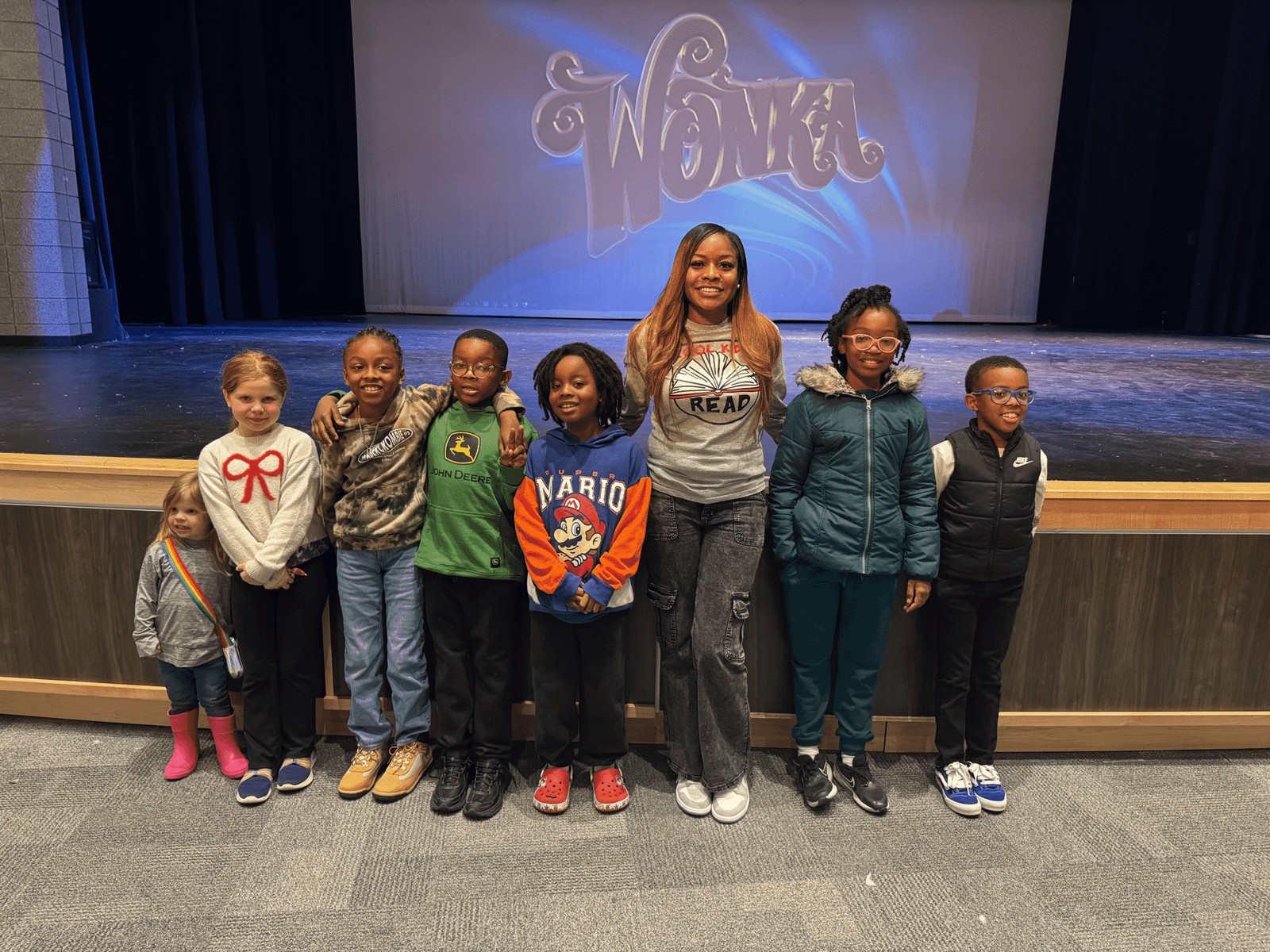 Ms. Nathan with Cool Kids Read book club students